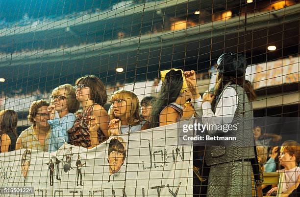 This is a general view of fans attending a Beatles concert, at Shea Stadium, circa 1965.