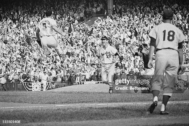 Sports Spectacular. Baltimore, Maryland: It's the final out of the 1966 World Series and staff photographer Darryl Heikes captures the jubilant mood...