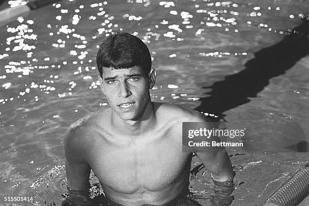 Mark Spitz, Santa Clara, California, won the men's 100 meter butterfly event in the 1966 National AAU Outdoor Swimming and Diving championships here...