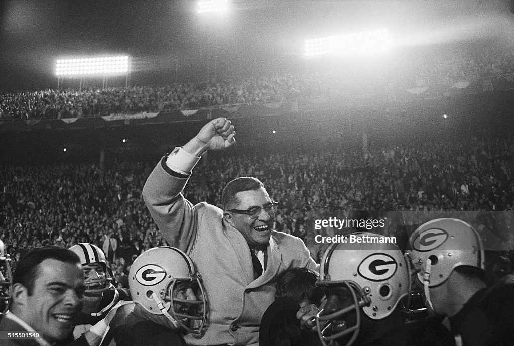 Vince Lombardi Being Carried by Football Players