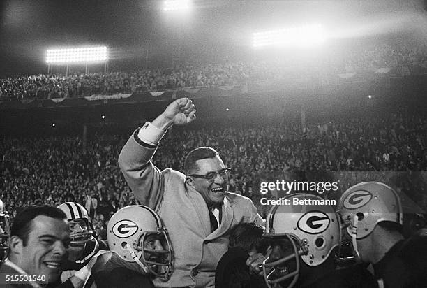 Vince Lombardi being carried by Green Bay Packers players after defeating the Dallas Cowboys.