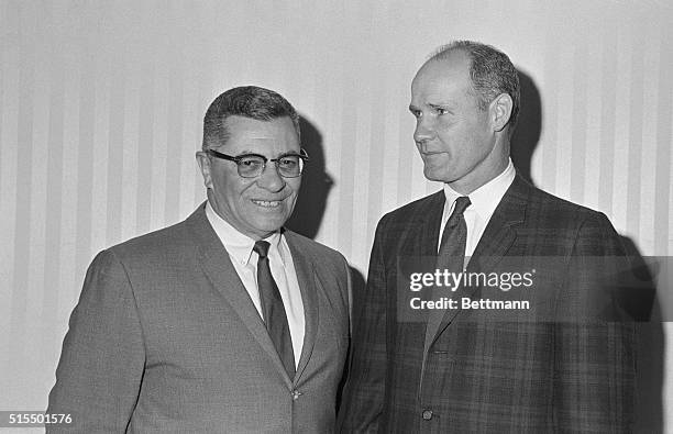 Green Bay head coaach Vince Lombardi and Dallas head coach TomLandry talk things over at a press conference held here 12/30 after the Packers arrived...