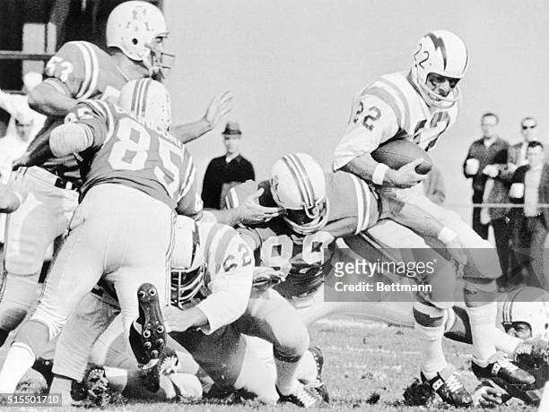 San Diego Charger running back Keith Lincoln is stopped at the line by Boston Patriots' defensive end Bob Dee during first quarter play at Fenway...