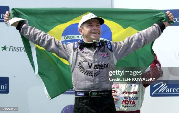 Roberto Moreno of Brazil celebrates his win at the Marconi Grand Prix of Cleveland 02 July 2000 at Burke Lakefront Airport in Cleveland, Ohio. Moreno...