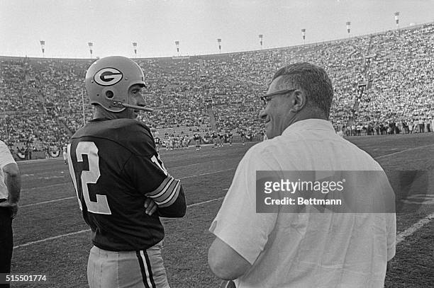 Head Coach Vince Lombardi, Green Bay Packers, talking to reserve quarterback Zeke Bratowski on sidelines during Super Bowl game against the Kansas...