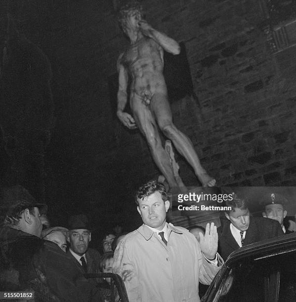 Florence, Italy: At the foot of a replica of Michelangelo's famous David statue in Florence's main Piazza, Sen. Edward Kennedy responds to cheers of...
