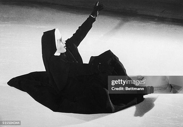 Sister St. Francis, a Canadian-born nun on the staff of Misericordia Hospital, takes a spill as she tries to execute the "sitting duck" maneuver on...