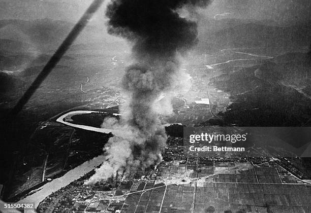 An extraordinary view from an airplane of the devastated and burning section of Tokyo, the result of the recent fatal earthquake. Hundreds were...