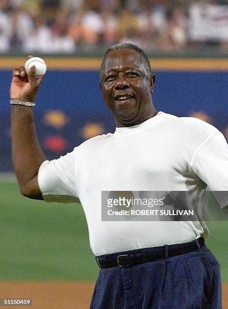 Baseball legend and Home Run King Hank Aaron throws out the first pitch 11 July at the 2000 All-Star game at Turner Field in Atlanta. AFP...