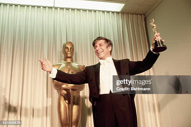 Elmer Bernstein is shown with his "Oscar" for Best Original Music Score at the Academy Awards presentations.