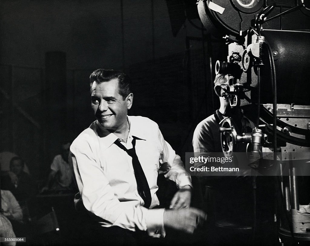 Desi Arnaz Sitting by Cameraman
