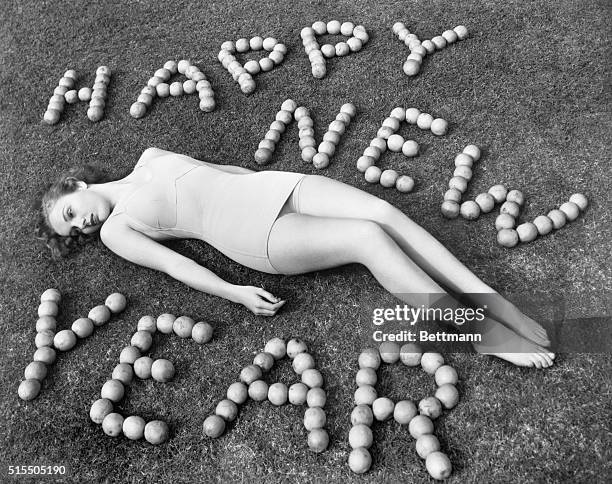Picture shows Warner Brothers starlet, Marilyn Menick, wishing you a Happy New Year. Undated photo circa 1950s.