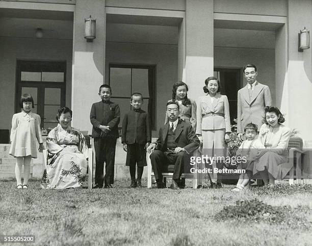 Japanese Emperor Hirohito poses with the Japanese Imperial Family, including his wife, Empress Nagako and his son, Akihito. Undated photograph, circa...