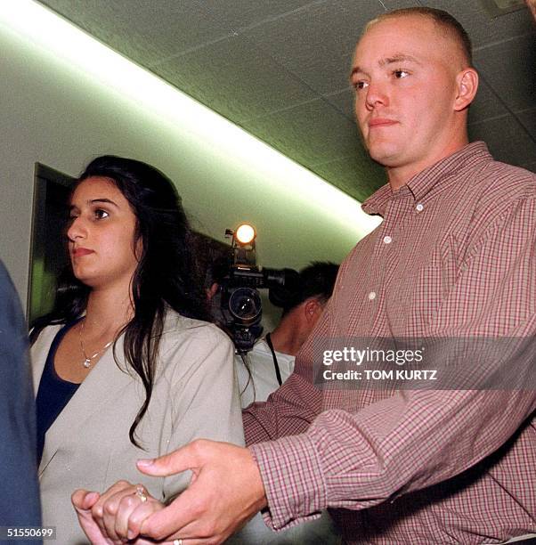 Meriam Al Khalifa , a member of the royal family of Bahrain, arrives for an immigration hearing 17 July with her husband Jason Johnson , a United...