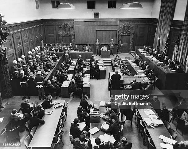 Wide angle shot of the entire courtroom at the International Military Tribunal Trials, as seen from the very important personnel section which is...