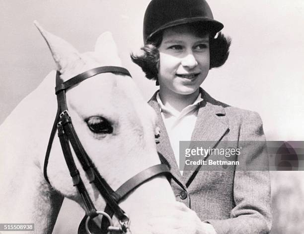 Crown Princess Elizabeth of Great Britain, later Queen Elizabeth II, with her pony, at age 10.