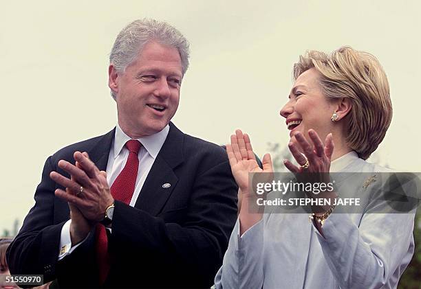 President Bill Clinton and First Lady Hillary Rodham Clinton laugh prior to addressing the 10th anniversary of the Americans with Disabilities Act at...