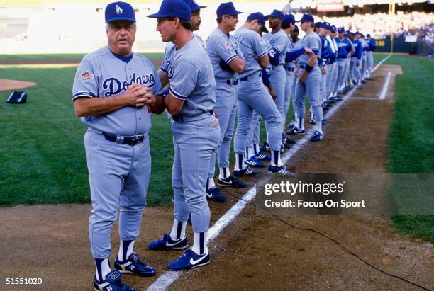 Manager Tommy Lasorda of the Los Angeles Dodgers looks on during introductions prior to game 3 of the World Series against the Oakland Athletics on...