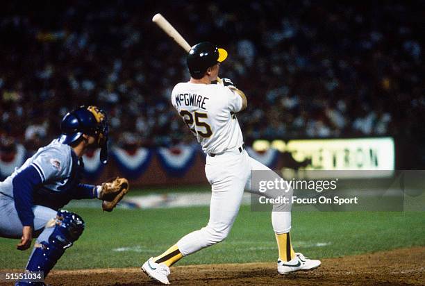 Mark McGwire of the Oakland Athletics watches his ball fly as he bats against the Los Angeles Dodgers during game 3 of the World Series at the...