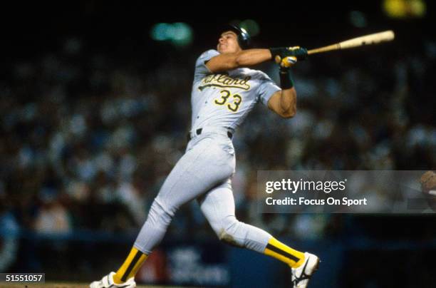 Jose Conseco of the Oakland Athletics bats against the Los Angeles Dodgers during game 1 of the 1988 World Series at Dodger Stadium in Los Angeles,...