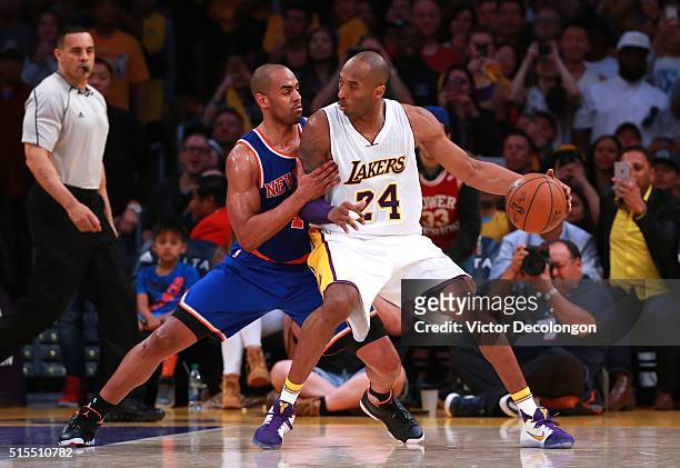 Kobe Bryant of the Los Angeles Lakers posts up Arron Afflalo of the New York Knicks during the second half of their NBA game at Staples Center on...