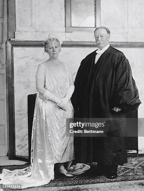 President William Howard Taft stands with the company of his wife, Helen Herron Taft, former Secretary of the Treasury.