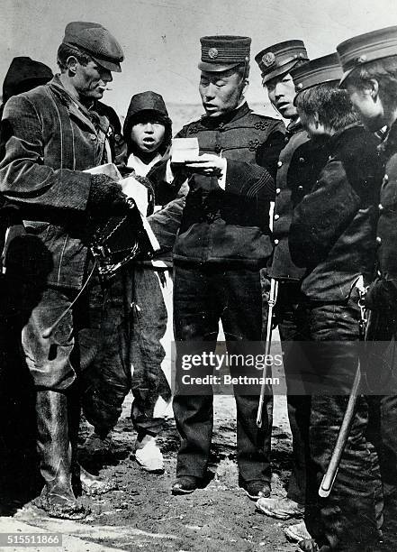 Jack London , American Writer, in Japan, shown with a group of military officials. Undated photograph.