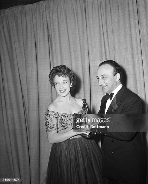 Mario Ungaso, vice consul of Italy accepts the "Best Foreign Picture" Oscar from Micheline Presle for The Bicycle Thief. 1950.