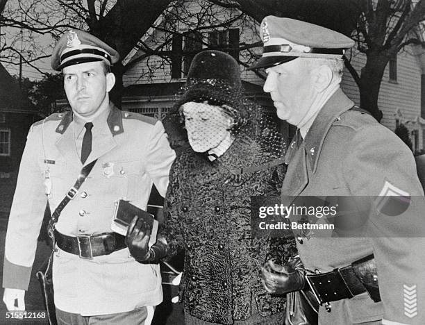 Mrs. Rose Kennedy, the President's mother, is shown on her way to a 7 a.m. Mass at St. Francis Xavier Church in Hyannisport. She is escorted by State...