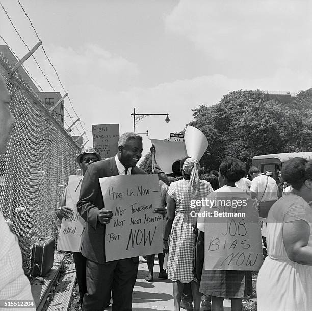Hall of Fame baseball player Jackie Robinson, first Negro to integrate the major leagues, joins pickets at construction site of Downstate Medical...