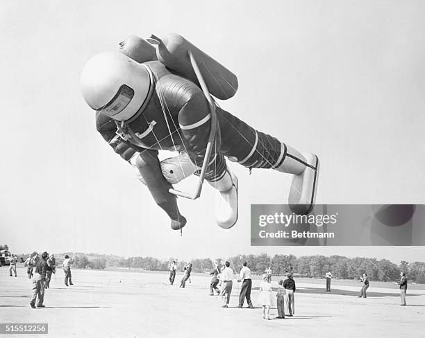 Giant spaceman balloon, 60 feet tall and 40 feet around, is one of the high-flying balloons which will be cheered by millions in Macy's Thanksgiving...