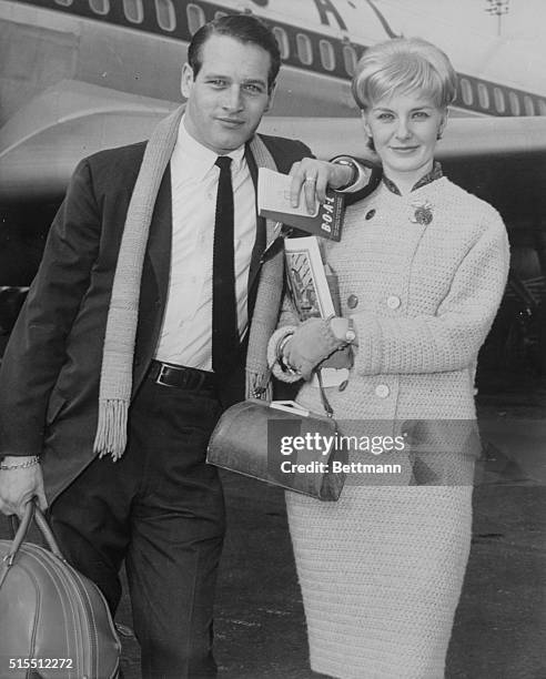 Both having completed recent films, actor Paul Newman and wife, actress Joanne Woodward leave New York's Idlewild Airport via Boac Plane for...