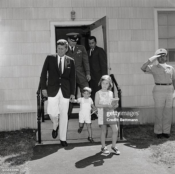 President Kennedy, little John John, and Caroline leave the hospital here, after a visit with the First Lady.