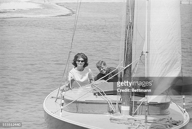 Full view of Senator and Mrs. John F. Kennedy enjoy final sail in the democratic presidential nominee's 32 feet Wianno Senior sail boat before his...