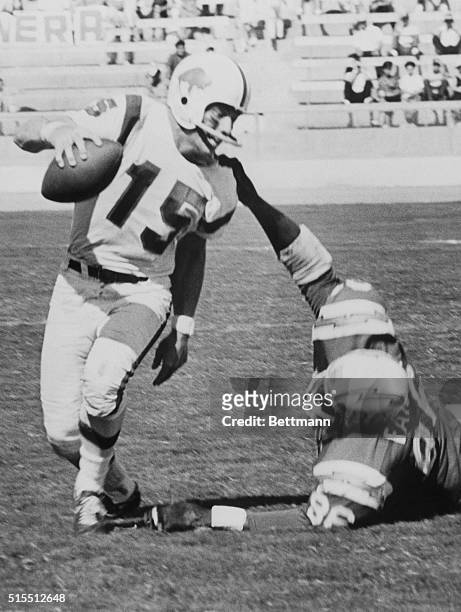 San Diego Chargers tight end Earl Faison pulls down the Buffalo Bills' quarterback Jack Kemp for an eleven yard loss. The Chargers won the game 14-10.