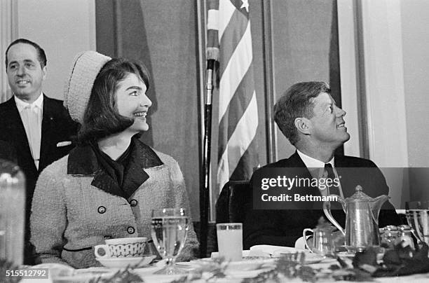 President John F. Kennedy with his wife, who was introduced at a Chamber of Commerce breakfast, November 22nd. Later in the day, an assassin firing...