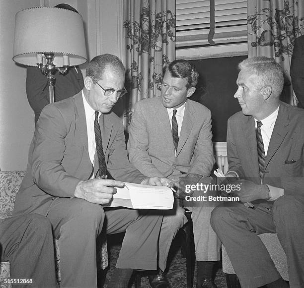 Bob Kennedy brother and campaign manager of Democratic presidential nominee, Sen. John F. Kennedy is shown at a press conference with two of his...