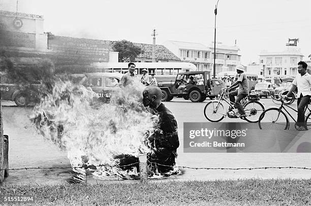 As a protest against the Ngo Dinh Diem government's anti-Buddhist policies, a young Buddhist monk performs a ritual suicide, by self immolation, in...