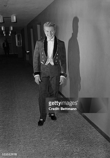 Liberace, famed for his wardrobe elegance, outdid himself with a collection of costumes he premiered at the opening of a Lake Tahoe engagement at...