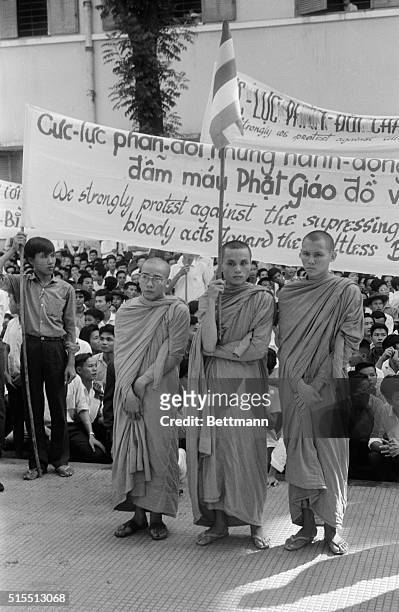 Buddhist monks hold signs protesting religious policies of President Ngo Dinh Diem August 18, in memorial services at main Xa Loi Pagoda here....