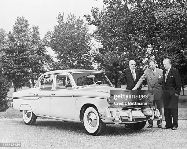 Officers of the new Sudebaker-Packard Corporation are shown with the new President State 4 door Sedan which is the luxury passenger car of the 1955...