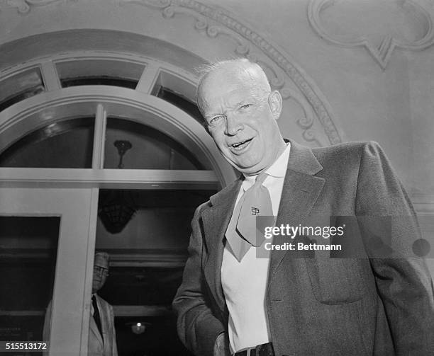 Sporting a colorful western tie, President Eisenhower is pictured, as he arrived at his summer Executive Office at Lowry Air Force Base. The...