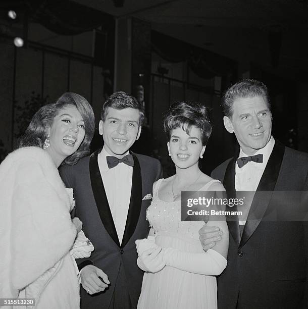 Stars at Ball. New York: Singers Lisa Kirk, Frank Sinatra Jr., and Liza Minnelli, daughter of Judy Garland pose with French actor Jean Pierre Aumont...