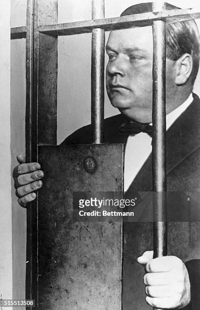 Composite photograph of Fatty Arbuckle and prison bars created after Arbuckle's arrest on charges of manslaughter.