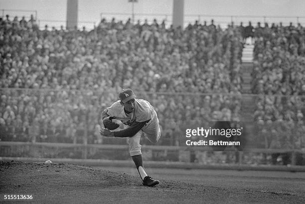 Baseball's premier hurler Sandy Koufax of Dodgers goes thru his motions against Minnesota Twins here 10/14 en route to a 3-hit shutout, 2-0, which...