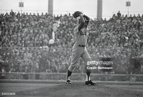 Baseball's premier hurler Sandy Koufax of Dodgers goes thru his motions against Minnesota Twins here 10/14 en route to a 3-hit shutout, 2-0, which...