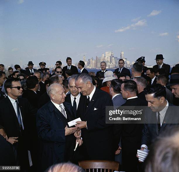 President Lyndon Johnson shakes hands with David Dubinsky, president of the International Ladies Garment Workers Union, today, October 3rd, at...