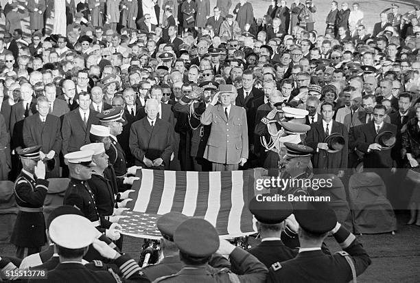 Final tribute. Arlington, Va.: Foreign dignitaries render a final tribute to the late President John Fitzgerald Kennedy as honor guard holds National...