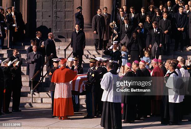 Washington, DC: The assassination of John. F. Kennedy, Cardinal Cushing imparting a blessing over his coffin as Mrs. Kennedy with her two children...