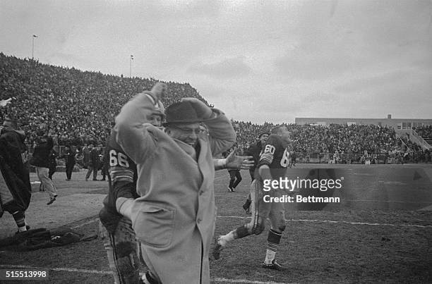 Happy coach is Packerson Vince Lombardi as he is carried off field by Ray Nitschke after team beat Baltimore Colts 13-10 in sudden death period of...